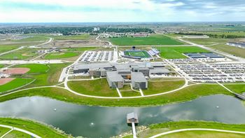 An aerial view of an industrial park with a body of water